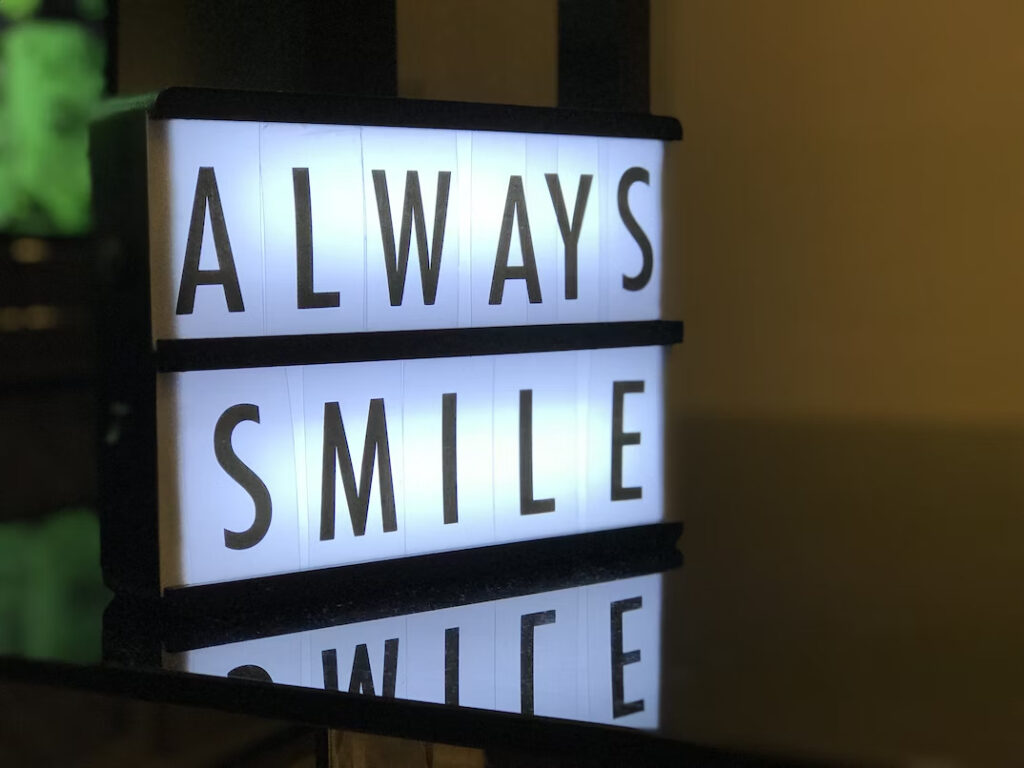 an always smile signage